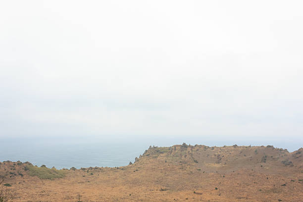 istock crater with blue sea on Jeju Island 478281236
