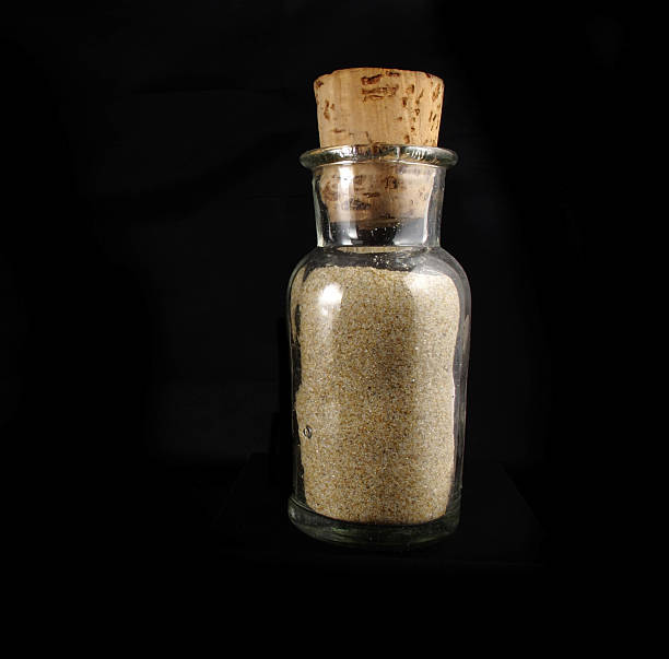 istock transparent glass bottle with sand 478284137