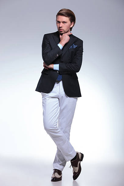 istock pensive business man with feet crossed 478285733