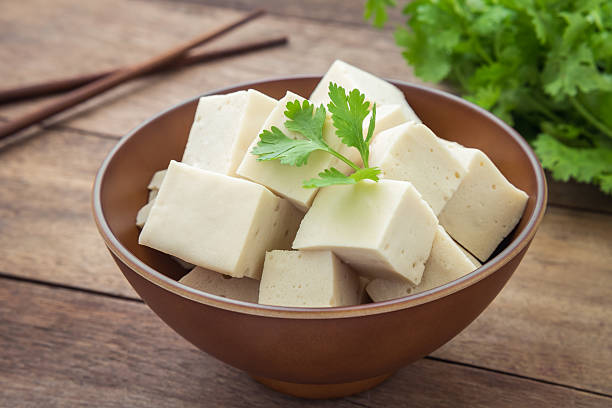 Tofu cubes in bowl and parsley Tofu cubes in bowl and parsley tofu photos stock pictures, royalty-free photos & images