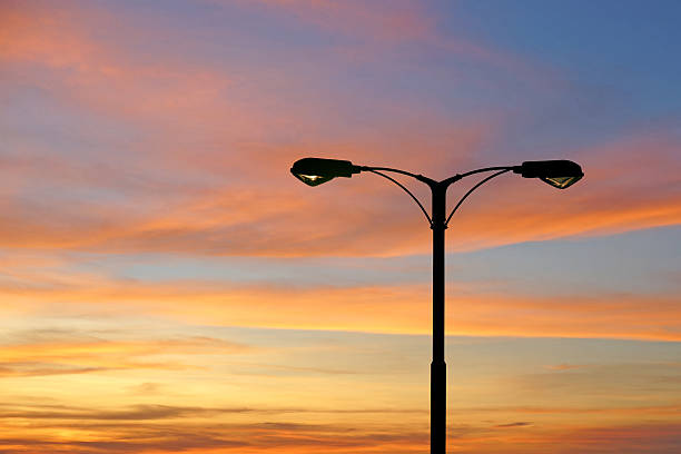istock silhouette of streetlight with beautiful twilight 478287094