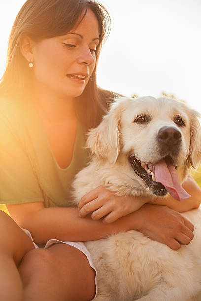 istock Young woman with dog 478287567