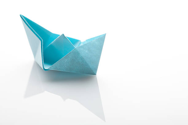 istock Origami paper ship on white background 478287624