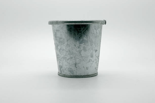 Metal zinc bucket on a white background Metal zinc bucket on a white background zinced steel stock pictures, royalty-free photos & images