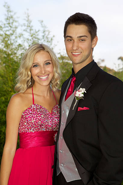 istock Prom Couple Smiling PInk Dress 478290769