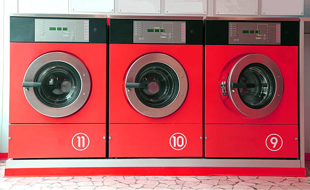 istock three red washing machines in coin laundry 478291830