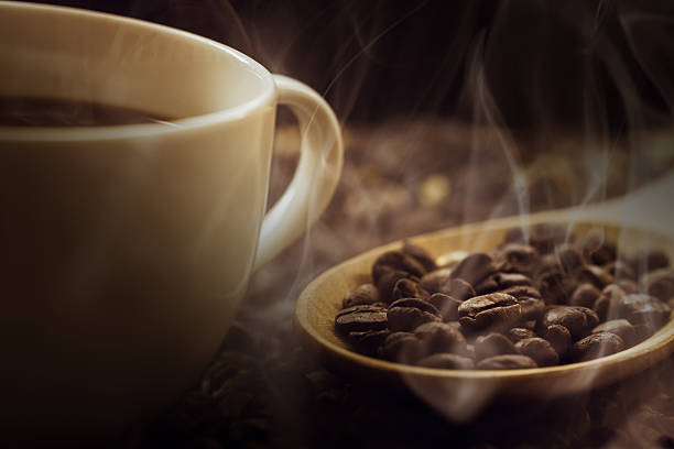 istock close up of fresh coffee beans with smoke 478292954