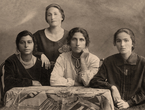 A vintage photo portrait from 1914 of Gypsy family.