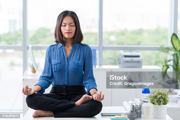 Meditation In Office Stock Photo - Download Image Now - Meditating, Zen-like, Office