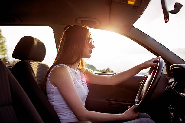 istock atractive woman driving a car 478296090