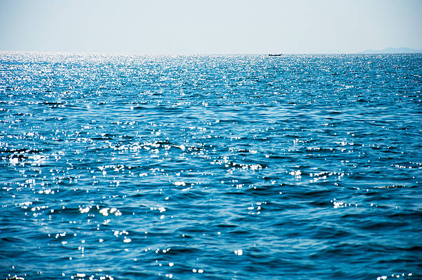 Long-tail boat on ocean view in sunny summer day