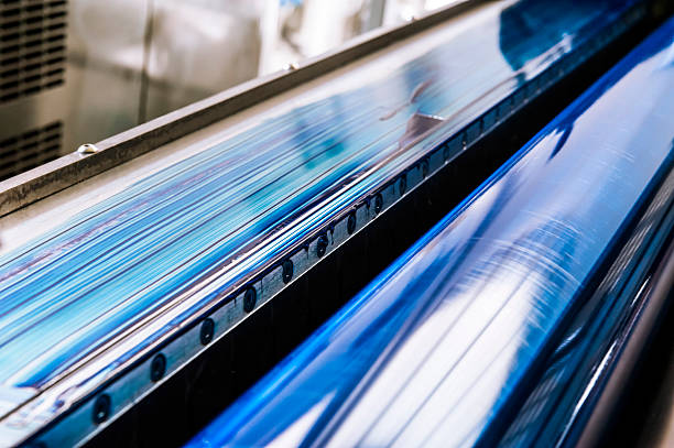 Blue Printing Roller of a CMYK Industrial Lithograph Printer stock photo