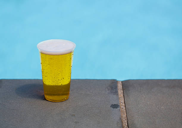 istock Golden lager or beer in disposable plastic cup 478297249