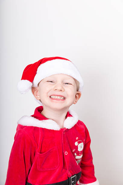 istock Boy dressed as Santa at Christmas 478298551