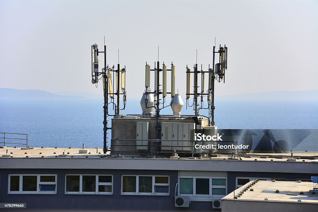 big antenna on the roof of building Element of communication devices, big  antennas mounted on a roof Animal Antenna Stock Photo