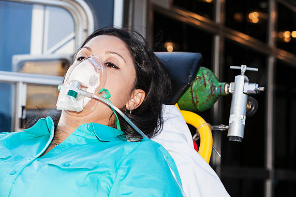 istock Hispanic woman on ambulance stretcher 478299837