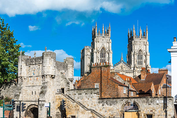 York city view York city view with the mediaeval gate, tower and York Minster in the background york yorkshire stock pictures, royalty-free photos & images