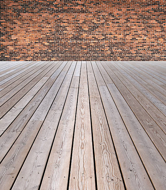istock wooden floor and brick wall 478301201