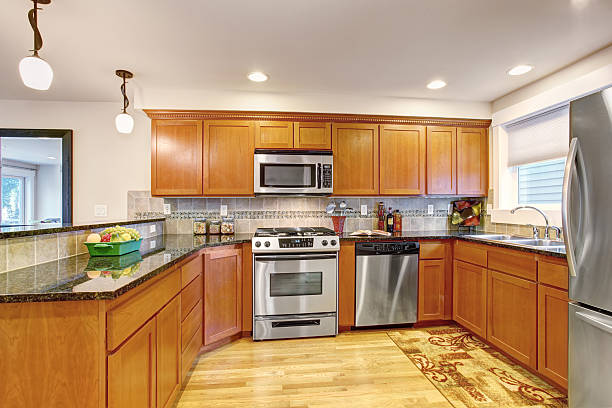 istock Maple kitchen cabinets with steel appliances and granite tops 478302182