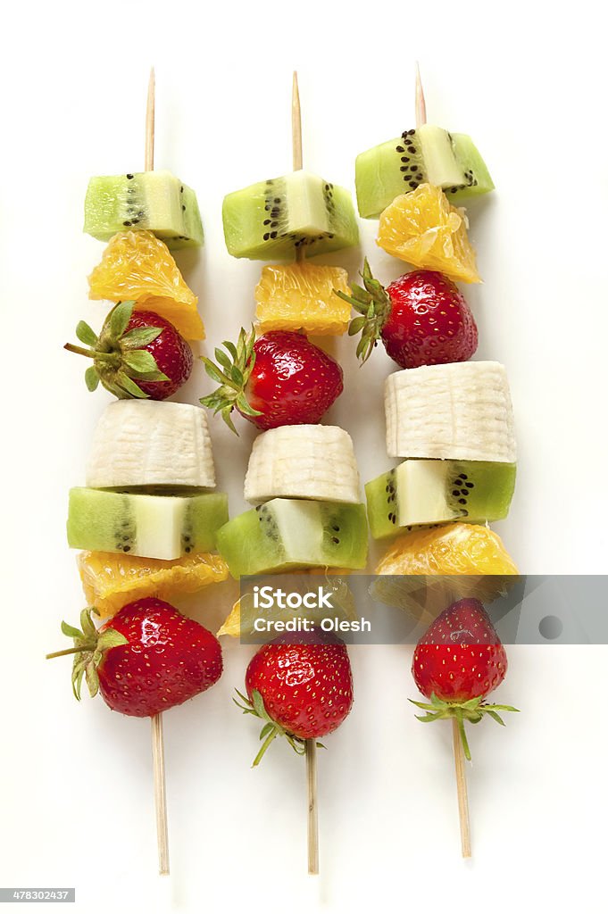 Fresh fruit on the skewers Fresh fruit on the skewers  on the white background Fruit Stock Photo