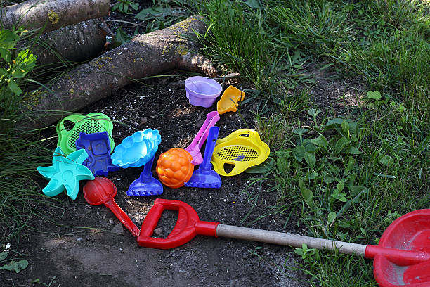 istock colored toys on the grass and earth 478304464