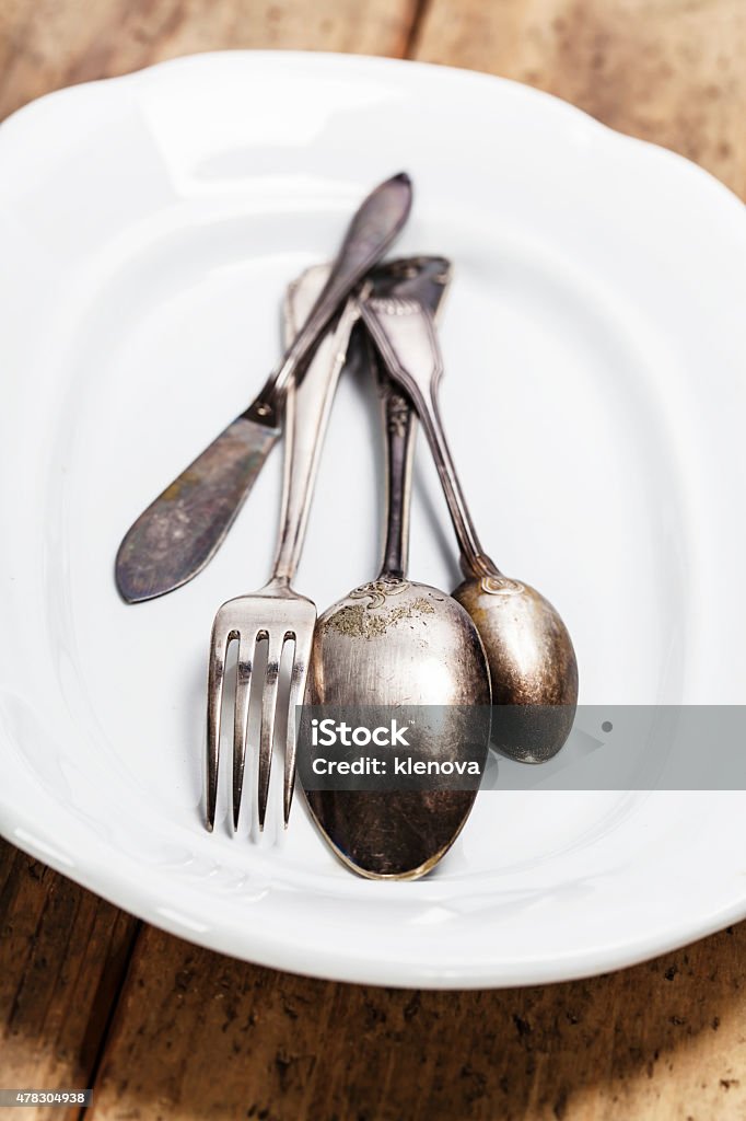 Vintage silverware Vintage silverware on a plate 2015 Stock Photo