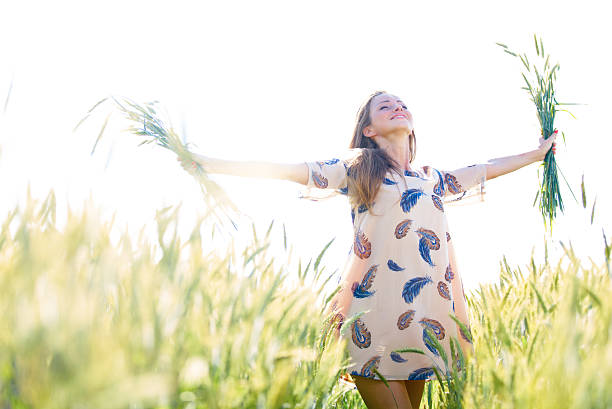 istock Young woman on wheat field in sunny day 478305347