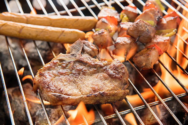 istock Assorted delicious grilled meat over the coals on a barbecue. 478310268