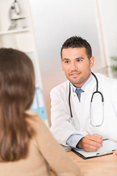 istock Doctor with patient 478310692