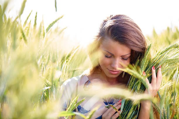 istock Young woman on wheat field in sunny day 478310861
