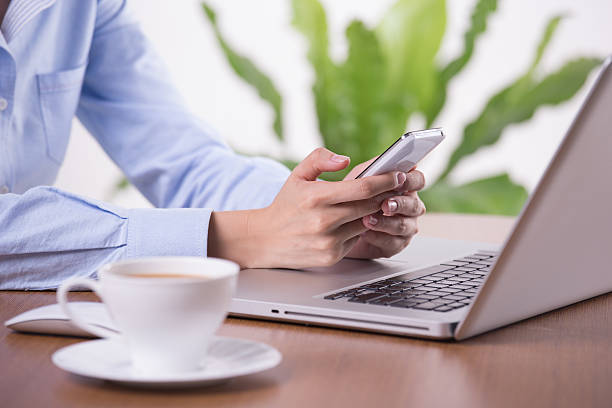 istock businesswoman texting - Stock Image 478310955