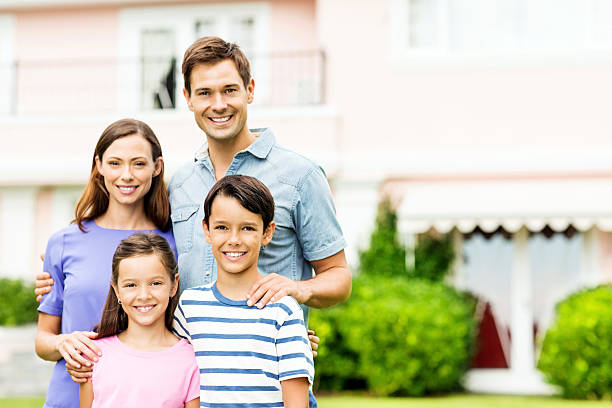 istock Happy Family Standing Together In Front Garden 478311212