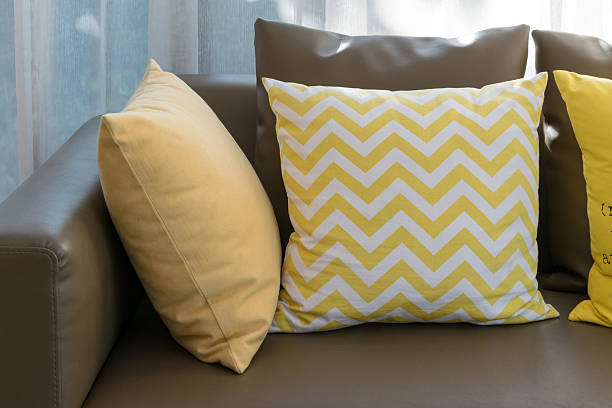 istock modern living room design with brown sofa and yellow pillows 478311888