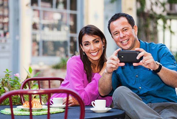 istock Hispanic couple at sidewalk cafe 478312087