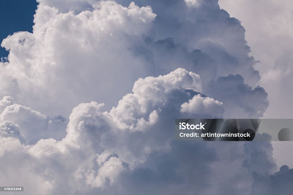 Close-up big fluffy  in the blue sky Close-up big fluffy white clouds in the blue sky 2015 Stock Photo
