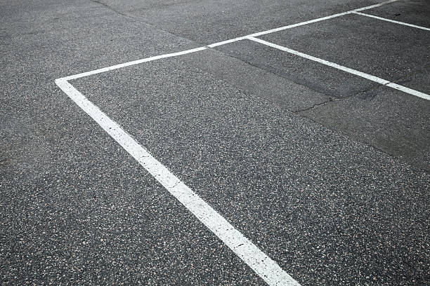 istock Empty slots on urban parking lot, white marking 478312460