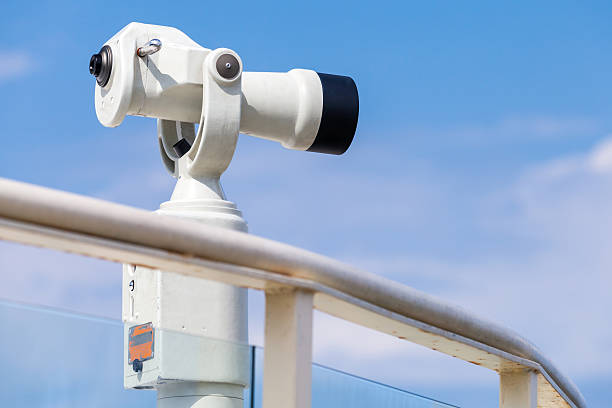 istock White stationary paid telescope on sea coast 478314076