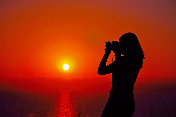 istock photographer silhouette at dusk 478314206