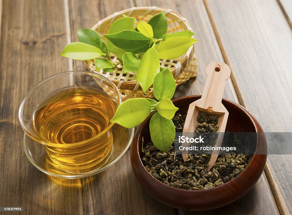 tea tea and tea leaves on wooden table Dried Tea Leaves Stock Photo