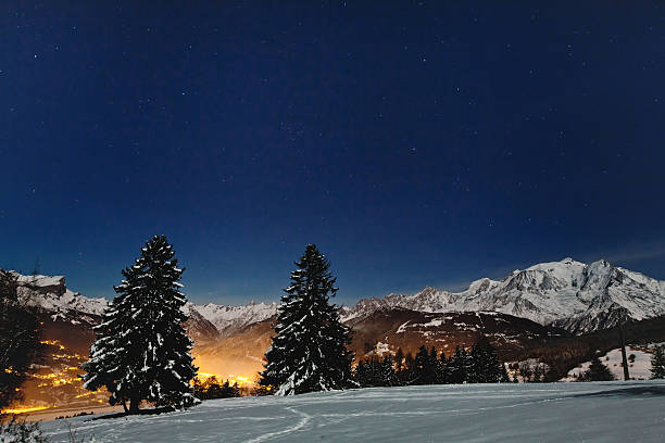 night in Alps beautiful christmas landscape with night stars on blue winter sky france village blue sky stock pictures, royalty-free photos & images