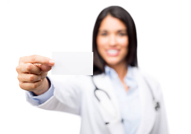 istock Doctor holding a business card 478319109