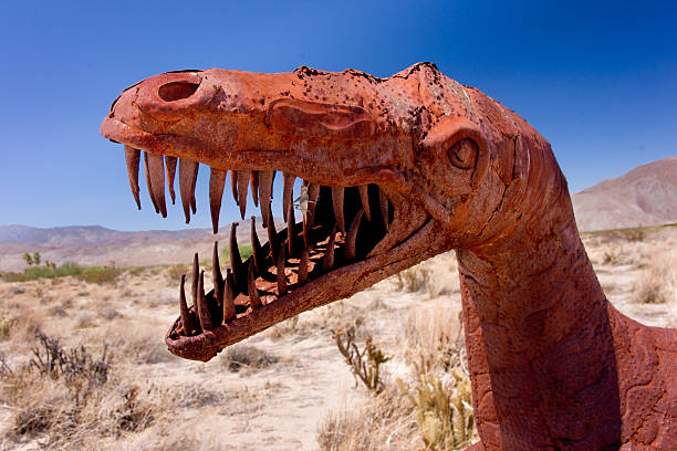 Desert Dinosaur A dramatic metal dinosaur roars in the remote California desert. borrego springs photos stock pictures, royalty-free photos & images
