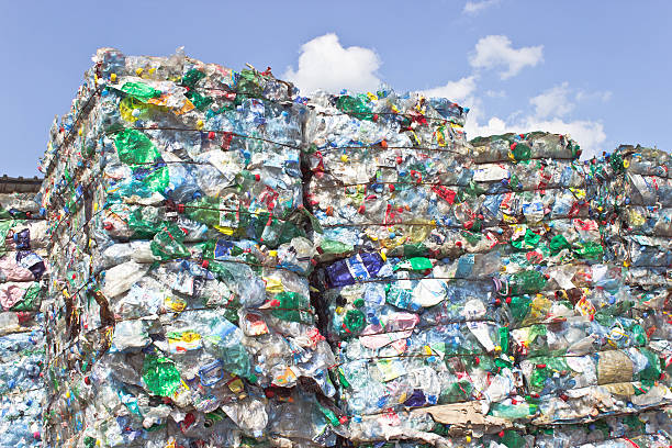istock Stack of plastic bottles for recycling against blue sky 478319710