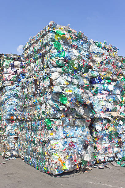 istock Stack of plastic bottles for recycling against blue sky 478319712