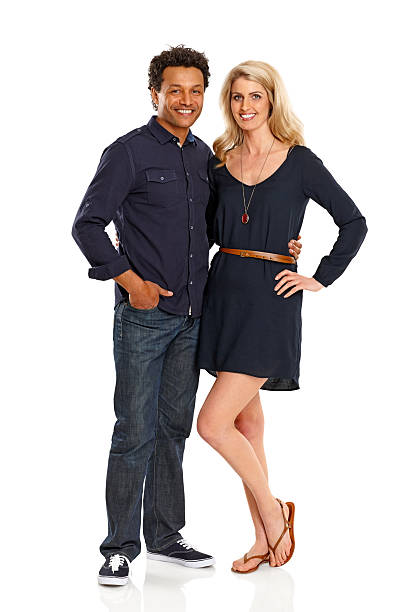 istock Happy couple standing together over white 478319773