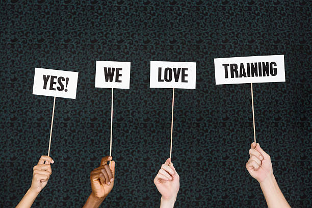 istock 'Yes we love training' say hand-held signs 478319911