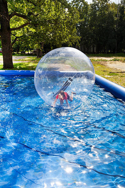 istock girl in water ball 478323445