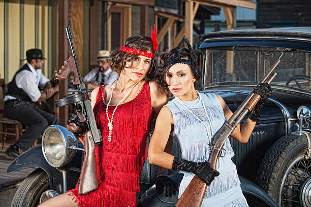 istock Attractive Female Gangsters with Guns 478323485
