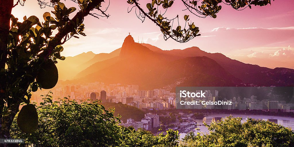 Christ The Redeemer Buildings at the waterfront with Christ The Redeemer statue in the background, Corcovado, Rio de Janeiro, Brazil Christ The Redeemer Stock Photo