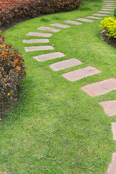istock Stone footpath in lawn field 478324140